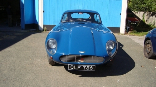 blue aston martin front view
