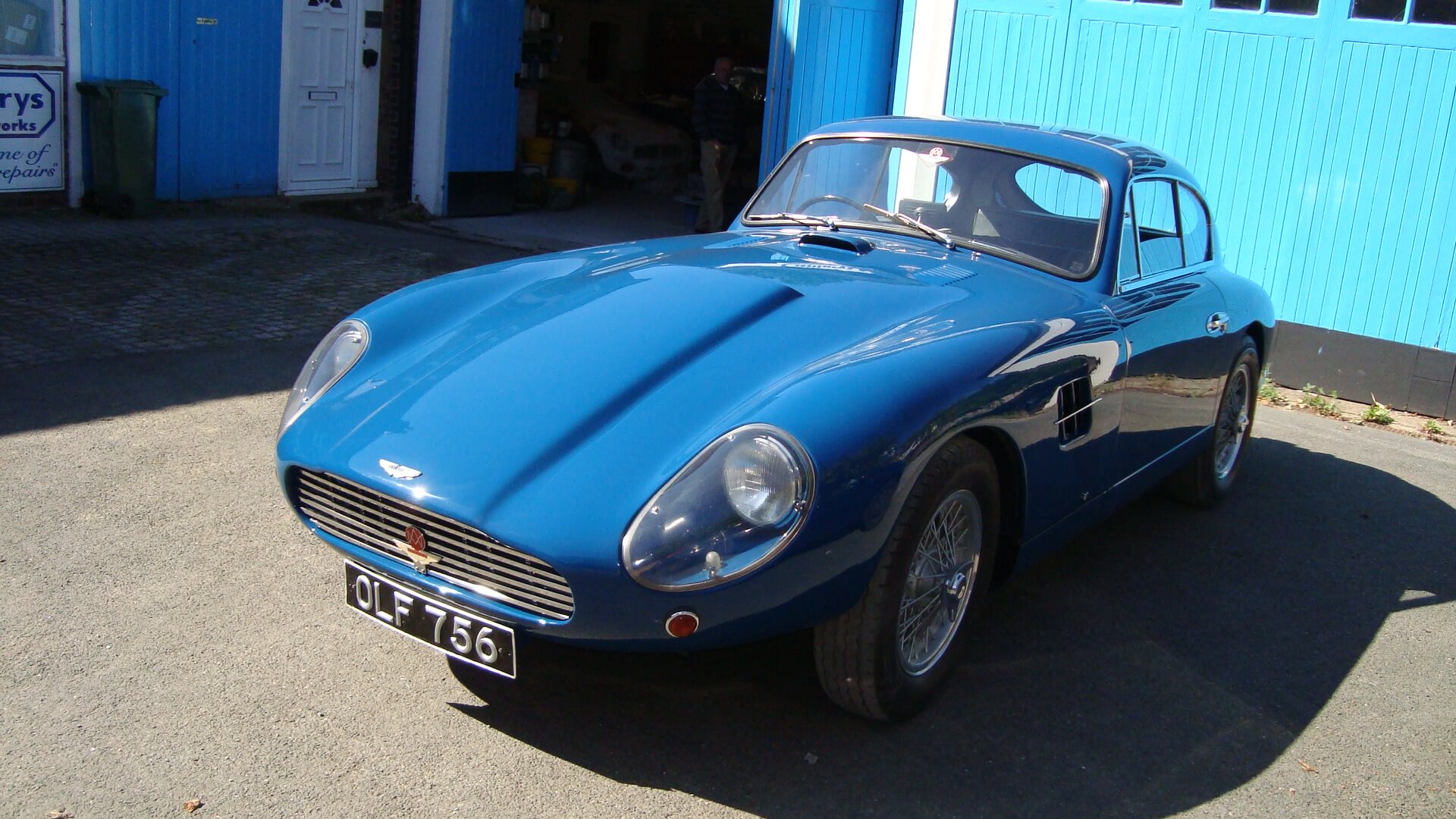 blue aston martin side view